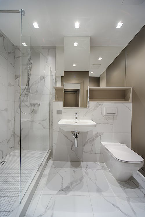 A small yet stylish bathroom with a glass door