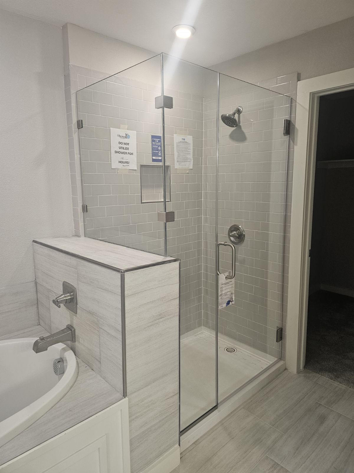 BEFORE AND AFTER INSATLL OF A NEW FRAMELESS SHOWER