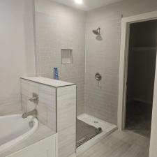 BEFORE-AND-AFTER-INSATLL-OF-A-NEW-FRAMELESS-SHOWER 0