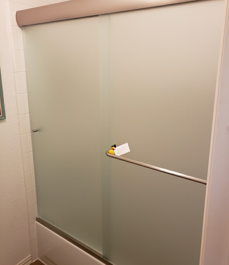 Frameless shower doors with privacy glass